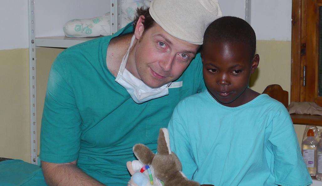 Prof. Cesare Faldini with a young patient at the Halibet Hospital of Asmara 